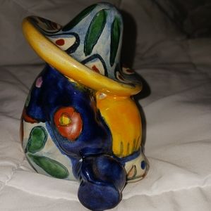 Unique figure sitting with a Sombrero on